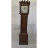 An oak 30 hour long case clock, with painted square dial having roman numerals and floral swags,