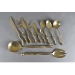 An Izabel Lam eight place sphere pattern flatware set, including knives, two pairs of salad servers,