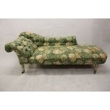 A 19th Century chaise longue, in William Morris upholstery, on turned legs and castors engraved