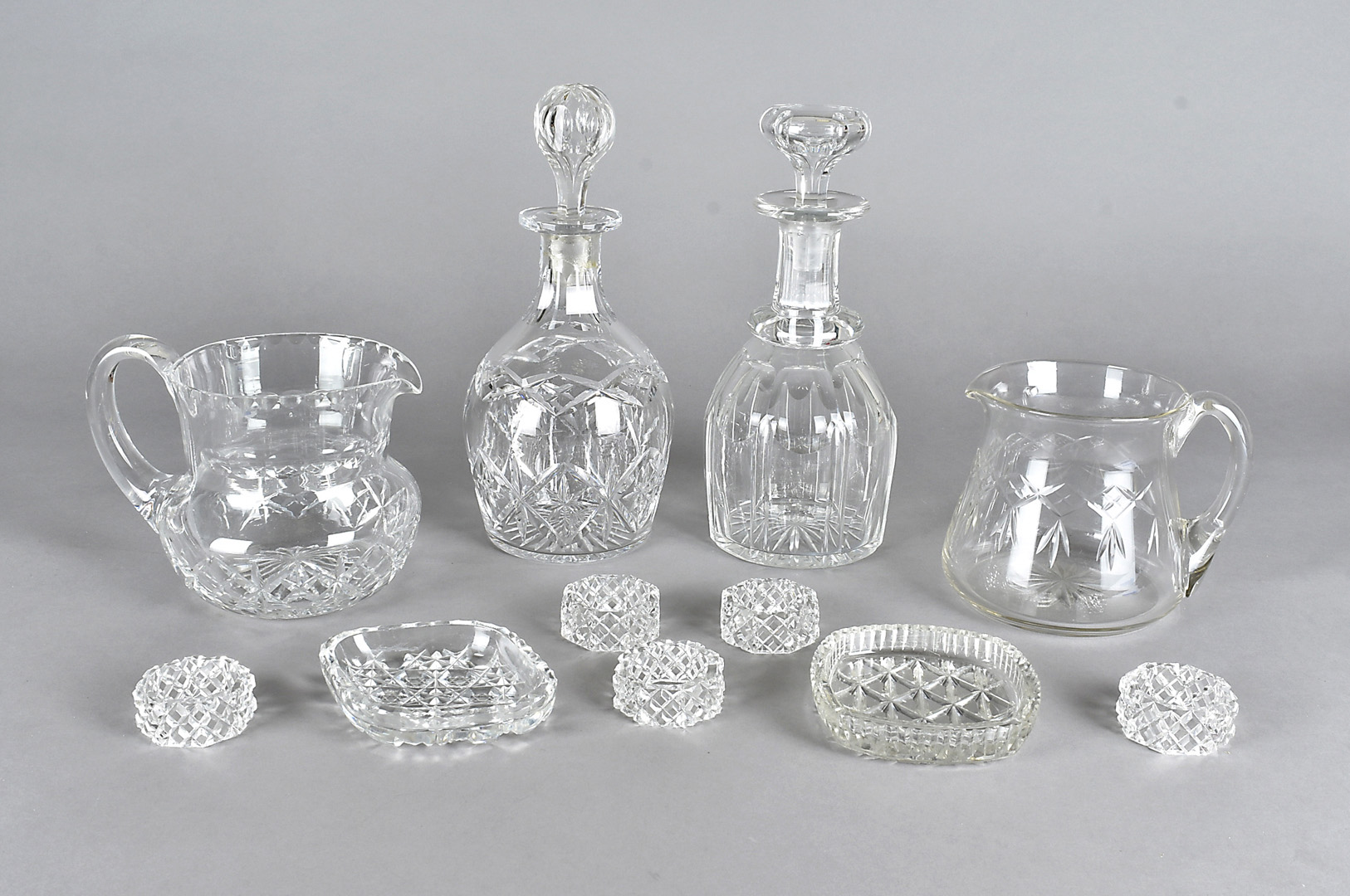 A 19th Century cut glass mallet shaped decanter and stopper, a similar example, a pair of cut