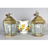 A pair of hexagonal brass and glass lanterns, the domed tops supporting tapered etched glass