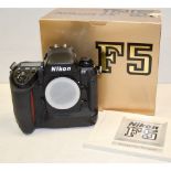 A Nikon F5 Camera Body, in manufacturer's packaging, body G/VG