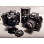 A Pair of Nikon F4 SLR Cameras, AF Nikkor 85mm f/1.8 lens and a Tamron SP 500mm f/8 mirror lens,