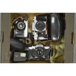 A Tray of Cameras, a Olympus OM20 with 50mm f/1.8 lens, a Praktica LTL 3 with a Domiplan 50mm f/2.
