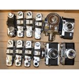 A Tray of SLR Bodies, a quantity of Chinon and Topcon together with a Zeiss Ikon Contaflex and a