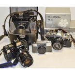 A Tray of Cameras, including Olympus Pen EE, a Rolleiflex SL26 SLR outfit, a Canon AV-1 SLR, Minolta