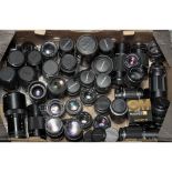Olympus OM System Lenses, various examples together with additional lenses from Pentax and Canon