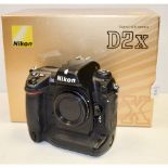 Nikon D2X Body, body G/VG in manufacturer's packaging with camera strap and battery