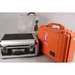 Camera Transport Cases, orange Peli Case, Phase One case and a painted aluminum case
