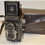 A Yashica 635 TLR Camera, with a Yashikor 80mm f/3.5 together with light meter, filters and lens