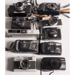 Rangefinder Cameras, a Mamiya Rank, Yashica 35-ME, Konica C35 and a Halina Autoflash 35 together