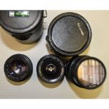 Olympus OM System Lenses, a 50mm f/1.4, and a 75 - 150mm f/4 in maker's case together with a Sigma
