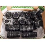 A Tray of Lenses Filters and Power Winders, including a Schneider 80mm f/4, Prakticar 28mm f/2.8,