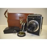 A Corfield 66 SLR Camera, with a Lumax 95mm f/3.5 lens an additional roll film back in maker's