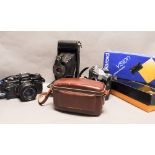 A Tray of Cameras, including a Praktica SC 1 electronic SLR with 50mm f/1.8 lens, a Kodak pocket