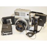 A Mamiya Super 23, with a Sekor 100mm f/3.5, 6 x 7 roll film back, 6x9 ground glass back, Polaroid