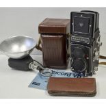 A Rolleicord Vb TLR Camera, with Xenar 75mm f/3.5 lens, body G, optics G together with a Rolleiflash