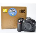 Nikon DSLR Body, a D80 10.2mp with a Nikon EN-EL3e battery, Nikon branded camera strap, various