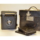 A Butcher Popular Pressman Camera, no 104091 with Aldis Butcher Anastigmat 6" f/4.5 together with