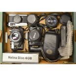 A Tray of Cameras, including a Nikon F-401 with AF Nikkor 35-70mm f/3.3-4.5 lens, a Cosina SLR,