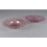 A pair of Venetian glass circular dishes, of lattice moulded design with crimped rim, pink and