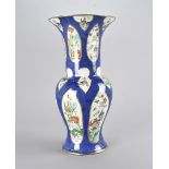 An Edwardian Staffordshire pottery vase, in the Chinese taste, having blue ground with florally