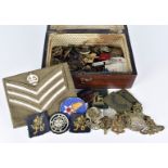 An assortment of badges and buttons, including a Royal Artillery, Royal Berkshire, Australian