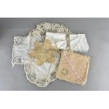 A pair of embroidered silk stockings, a pair of satin gloves, various lace handkerchiefs, borders