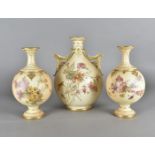 A Royal Worcester blush ivory garniture, comprising a large bulbous twin handled vase, with
