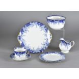 A Royal Doulton twelve place setting blue and white patterned tea service, heightened in gilt