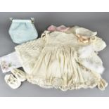A collection of late 19th and early 20th Century Christening outfits, bonnets, mid Century baby