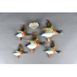 A set of five wall mounted flying Beswick ducks, model no 596 together with a Beswick duck pin