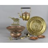 A collection of copper, brass metalware, including a spirit kettle and stand, a brass charger, a