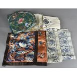 A pair of Chinese Peking knot sleeve rolls, with embroidered bat and sword and shield design, a