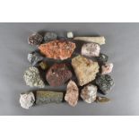 A collection of rock specimens, including marble, quartz, granite, iron, stalagmite and others (