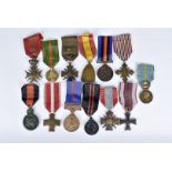 A collection of 13 Continental military medals, from various countries, including France, Belgium,