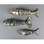 A set of three graduated mother of pearl and abalone articulated fish, bottle openers, largest 20
