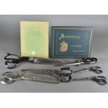 A collection of drapers and tailors scissors, comprising four large cloth scissors, one by