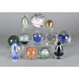 A collection of 20th Century British and European glass paperweights, all having internal bubble and