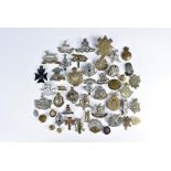 A collection of cap badges and buttons, comprising Royal Scots Greys Waterloo, Highland Cyclist