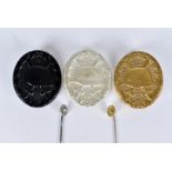 A group of three 1957 pattern German Wound badges, consisting of Black, Silver and Gold, all