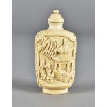 A 19th Century Chinese ivory snuff bottle, of ovoid shape, decorated with pagoda and figures, 7 cm