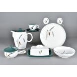 A collection of Denby Green Wheat dinner and teaware, including handled crock pots and covers,