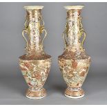 A large pair of Meiji period satsuma vases, with scroll twin handles and butterflies, 56.5 cm high