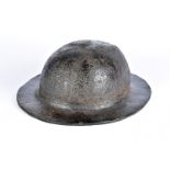 A 18th century leather brodie style helmet, the thick one piece leather helmet, in the shape of a