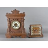 An Ansonia mantel clock, with eight day brass movement and enamel face with roman numerals in an