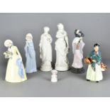 A Lladro figure of a Japanese fan dancer, a Nao figure of a praying young girl, a Wade pearly queen,