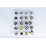 An assortment of 20 British and Overseas Fire badges, including Isle of Scilly, Warrington,
