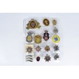 An assortment of Fire Helmet and other badges, including New South Wales, USAF, Air Force Dept,