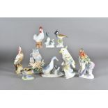 A quantity of porcelain and pottery bird figures, mostly continental